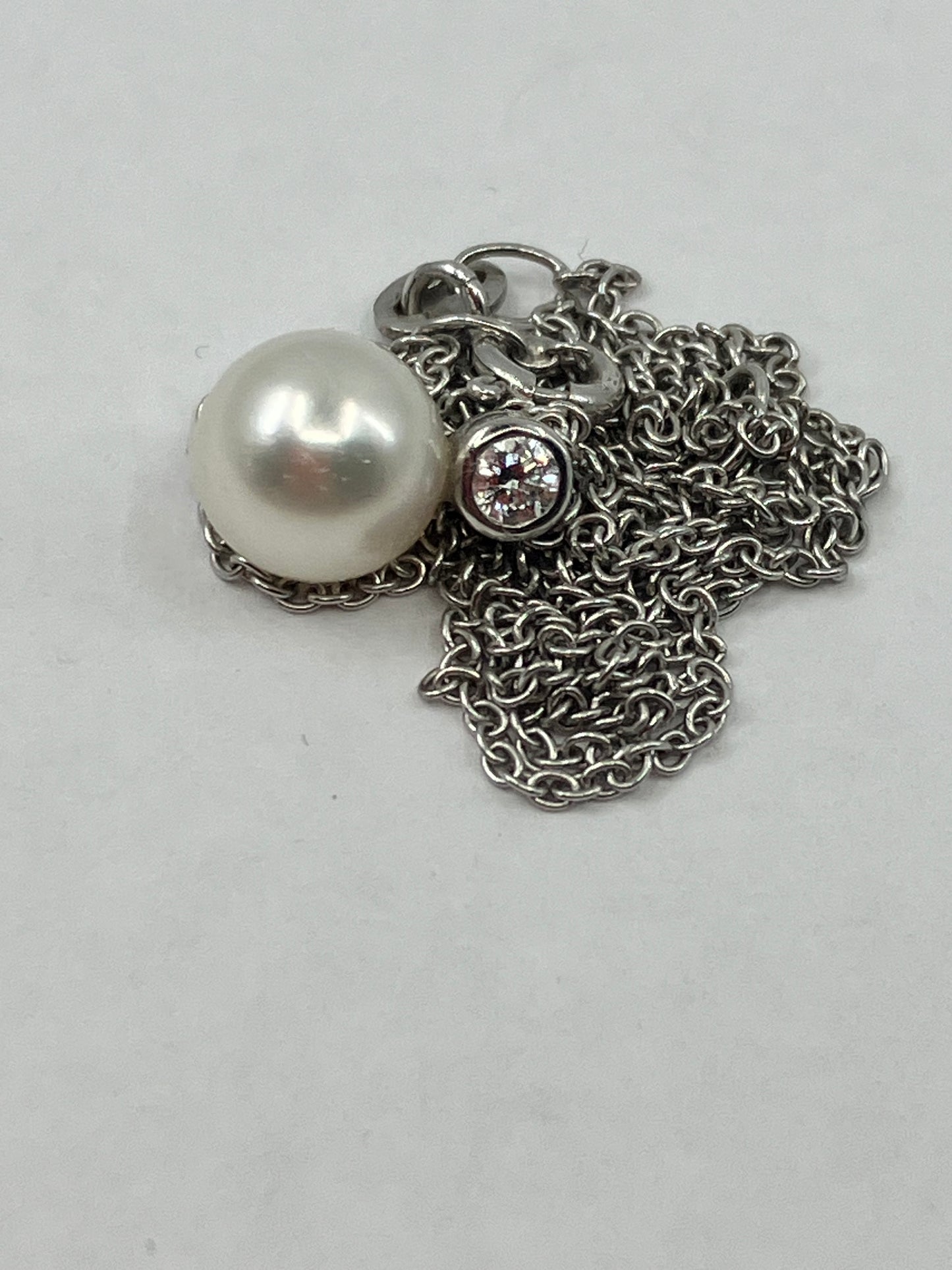Cultured Pearl & Diamond pendant on a white 18ct gold chain.