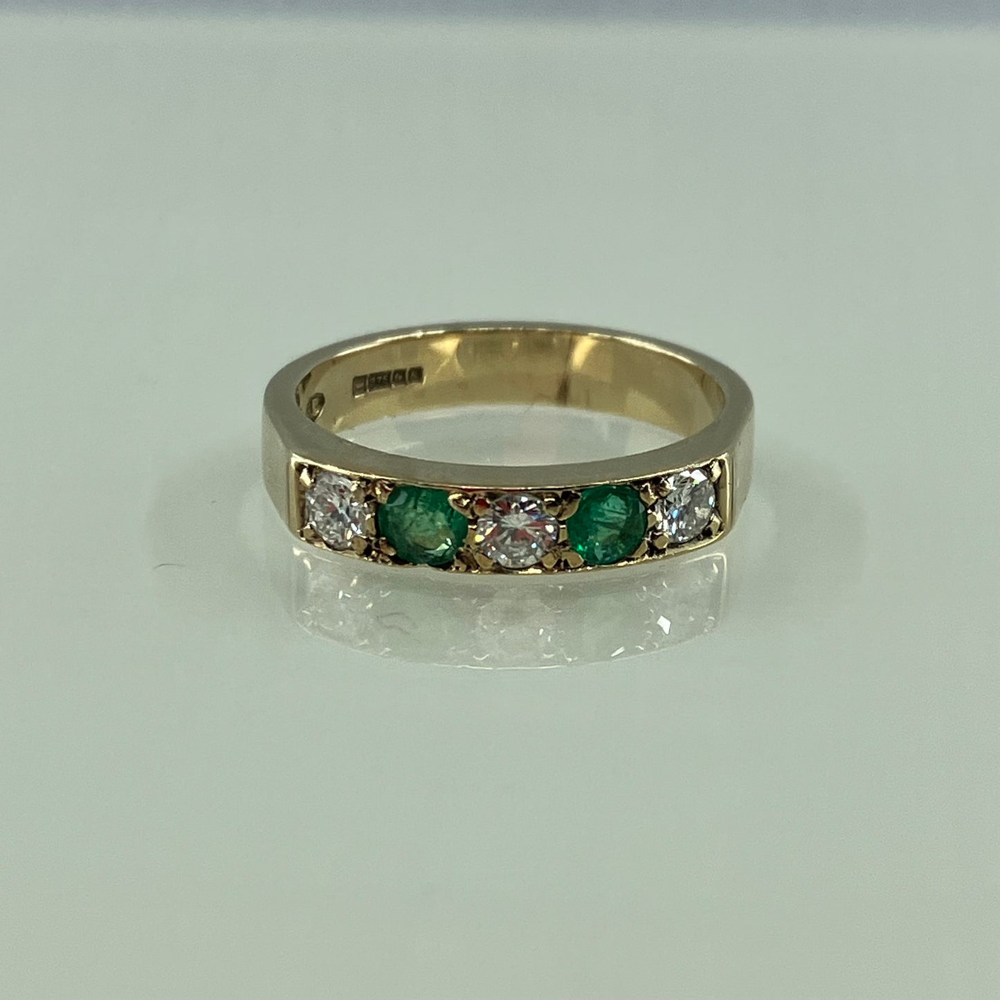 Emerald & diamond 9ct half-hoop ring