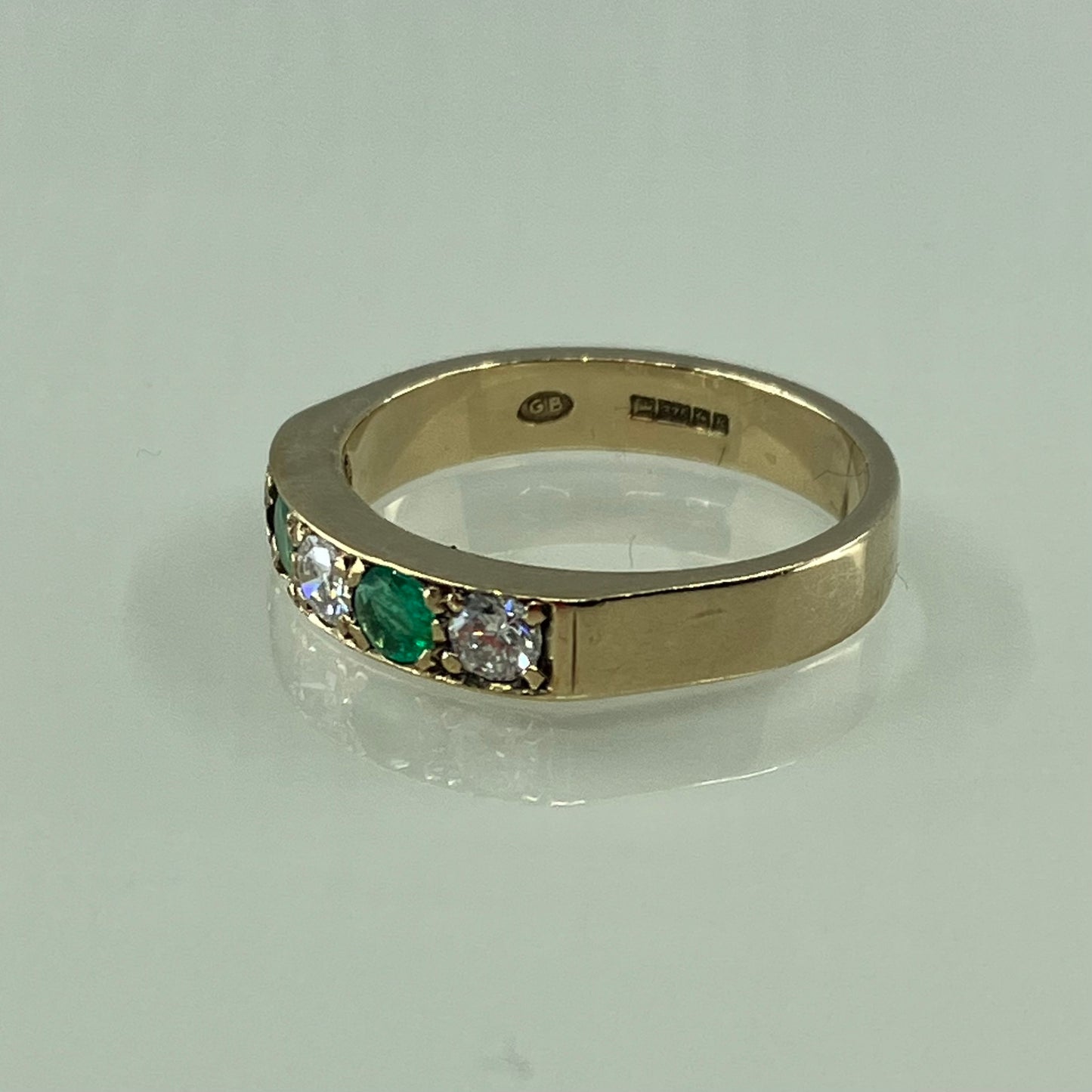 Emerald & diamond 9ct half-hoop ring